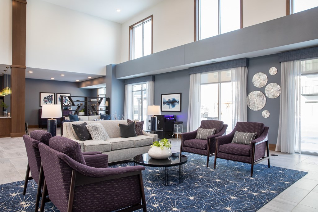 a living room filled with furniture and a large window  at The Edison at Spirit, Lakeville, MN, 55044