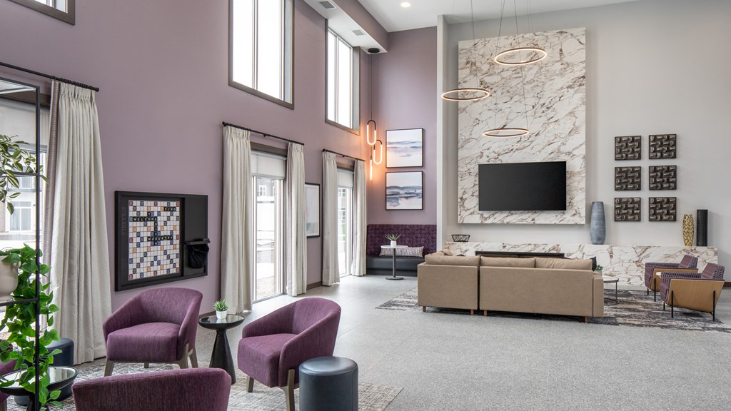 a rendering of a living room with purple walls and purple chairs  at The Edison at Woodbury, Minnesota, 55129