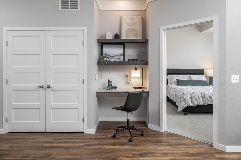 a bedroom with a desk with a chair and a bed at The Edison at Maple Grove, Maple Grove, 55129