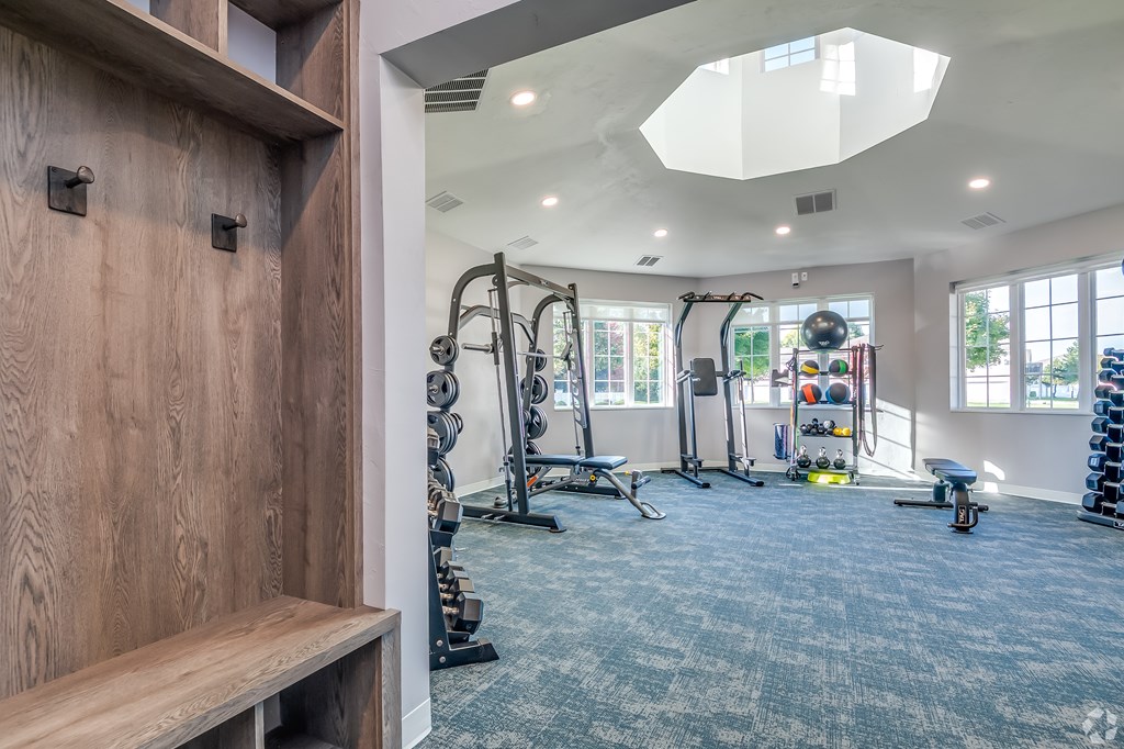 A well-equipped home gym with a variety of exercise equipment.
