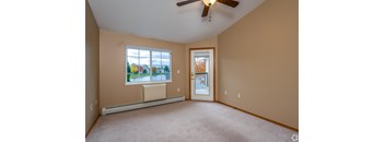 A room with a window and a door.