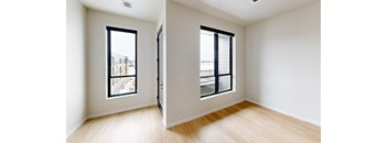 A room with a window and a door.