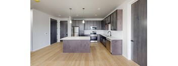 A modern kitchen with a large island in the middle.