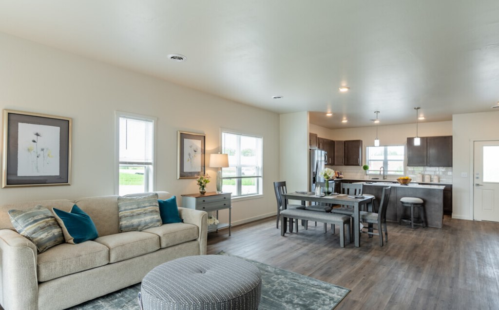 a living room and dining room with a couch and a table