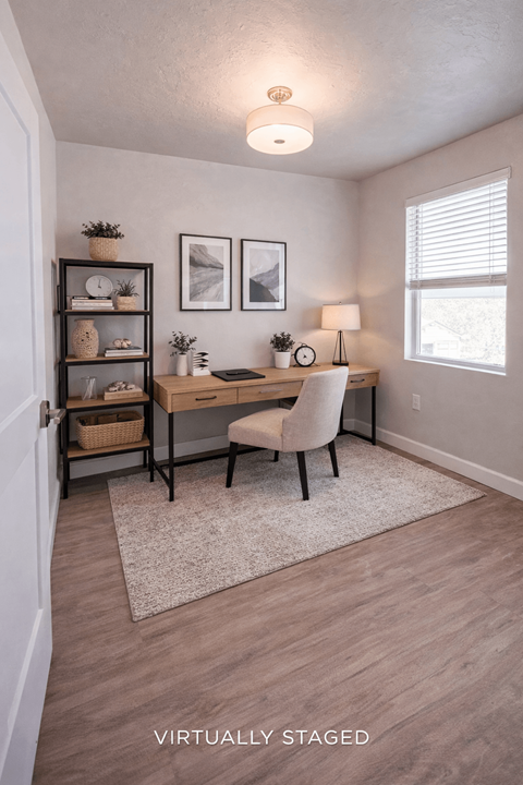 A virtual staged image of a home office with a desk, chair, and shelves.