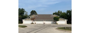 a house with a two car garage