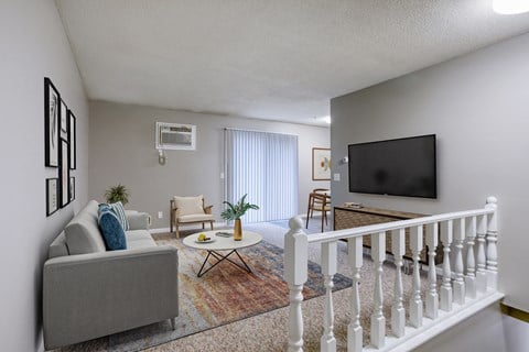 our apartments at the legacy have a living room and a tv