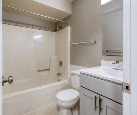 a bathroom with a toilet sink and bathtub