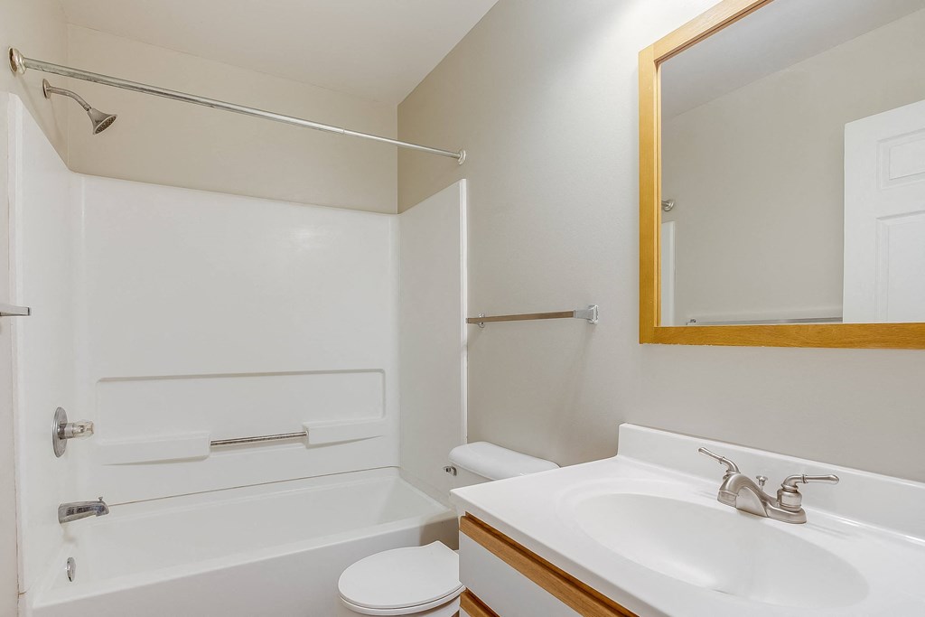 a bathroom with a bathtub and a sink