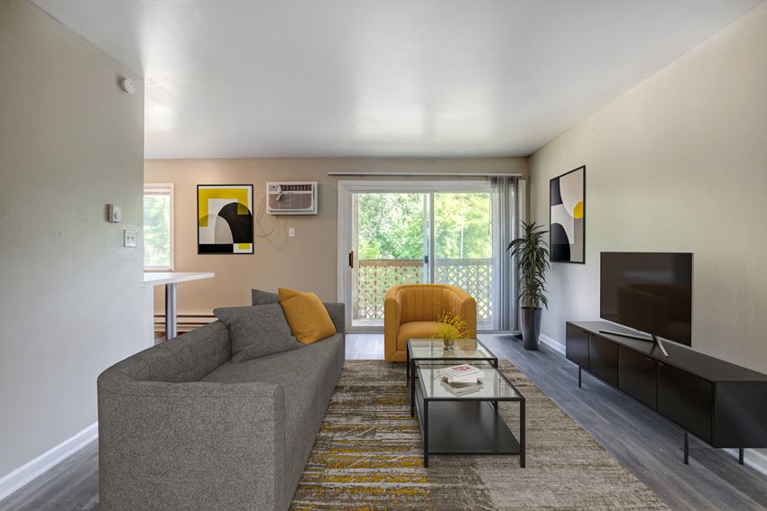 a living room with a couch and a coffee table - Photo Gallery