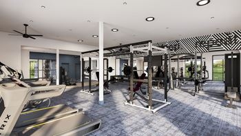a gym with treadmills and other exercise equipment in a building