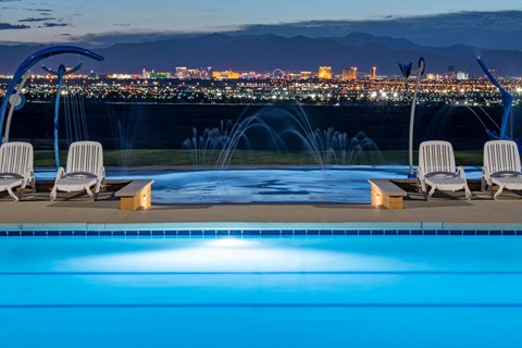 the pool with a view of the city at night