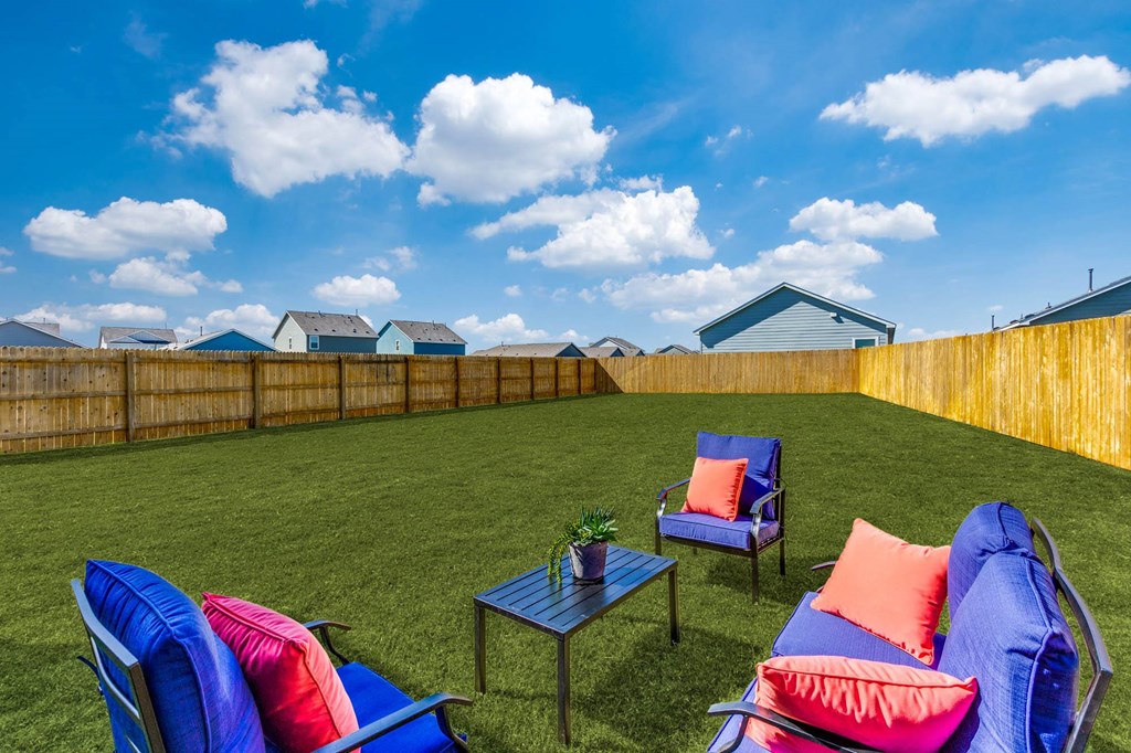 Linea Stillwater Rental Homes Backyard Lawn with Patio Furniture