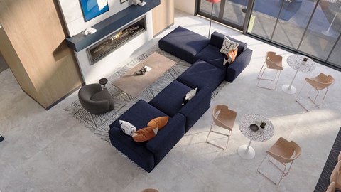 a living room with a blue couch and chairs