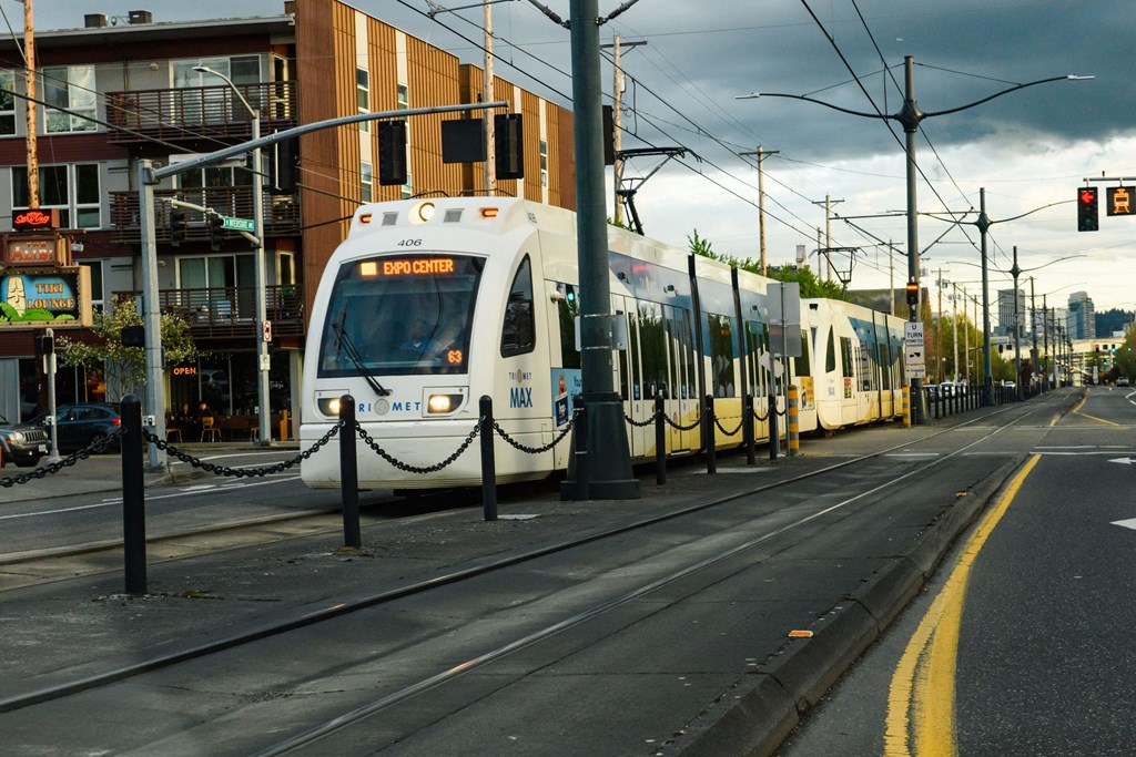 a train on the tracks on a city street
