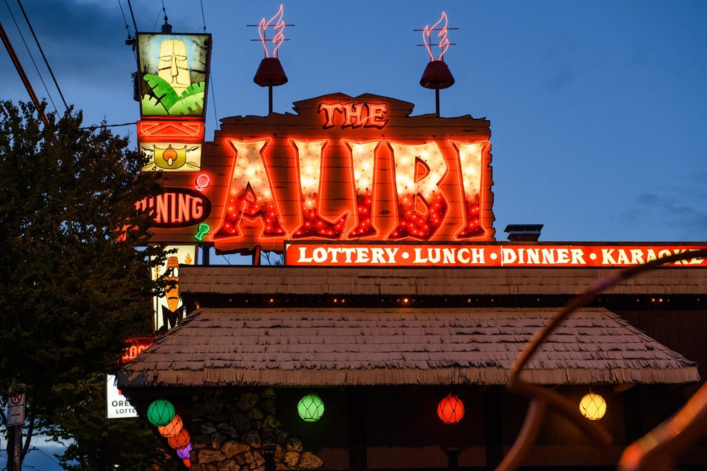 the war theater lit up at night at the war neon sign