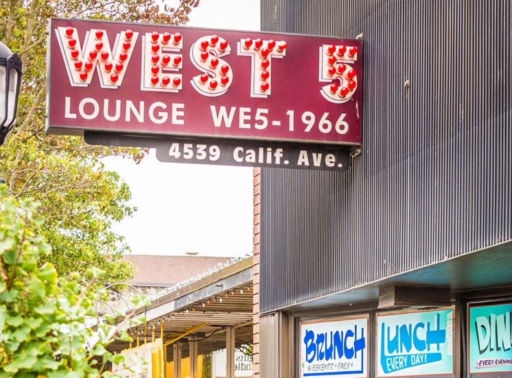 West 5 Lounge Neon Sign on Building