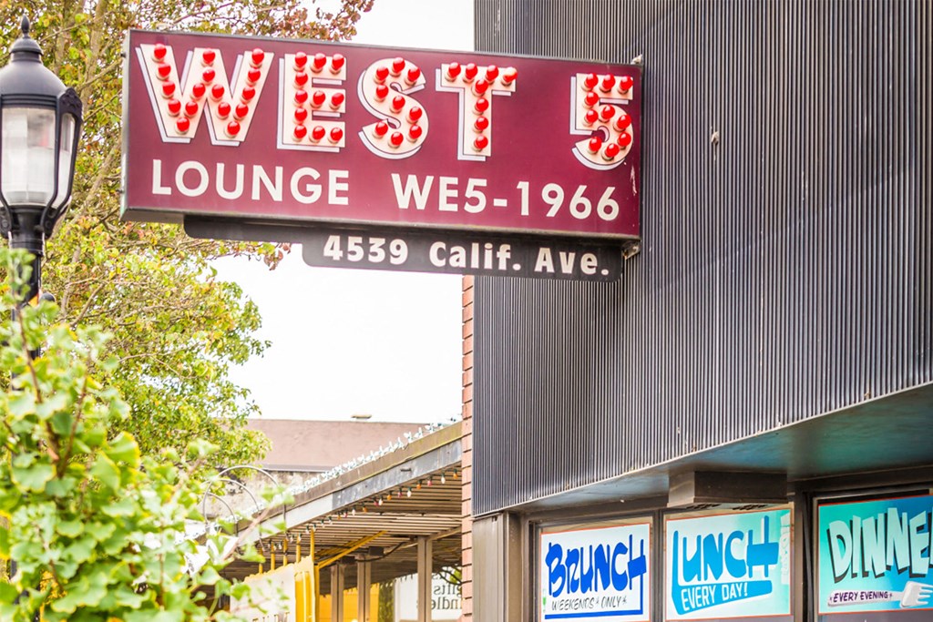 West 5 Lounge Neon Sign on Building