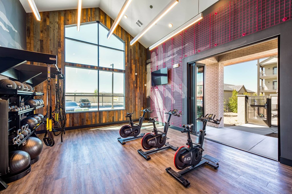 a home gym with a view of the water