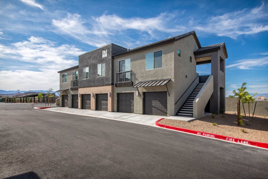 a new building with stairs and a parking lot