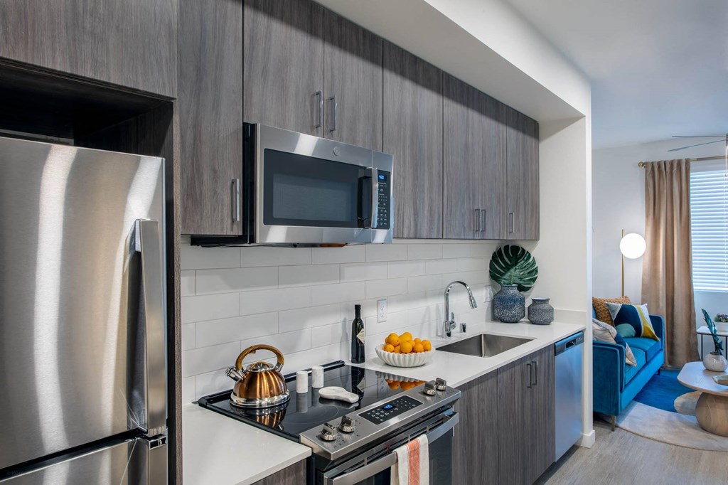 a kitchen with stainless steel appliances and a sink