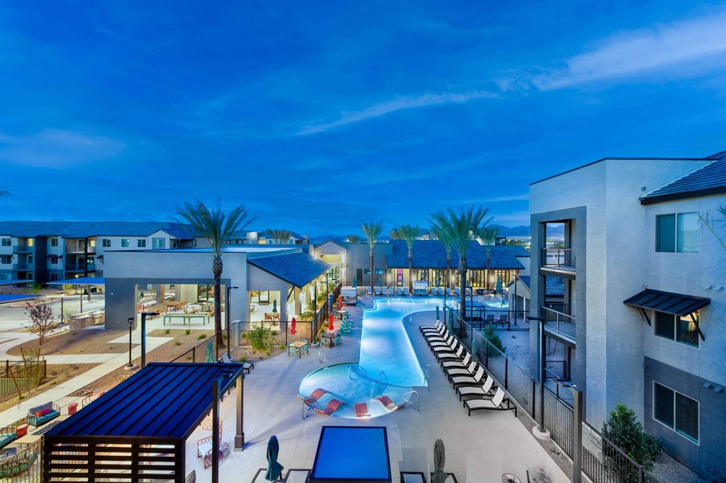 a swimming pool at a resort at night