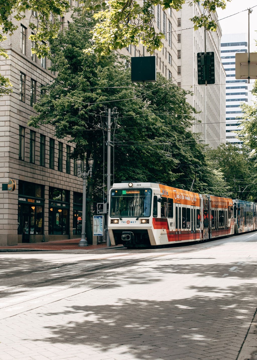 a train on the street in a city