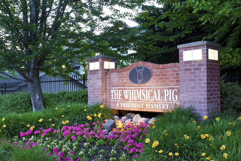 The Whimsical Pig Apartments Exterior Monument Sign