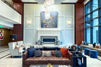 a large living room with a couch and a fireplace