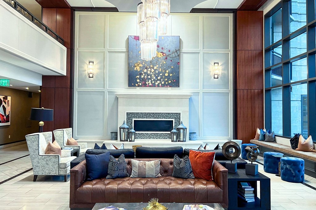 a large living room with a couch and a fireplace