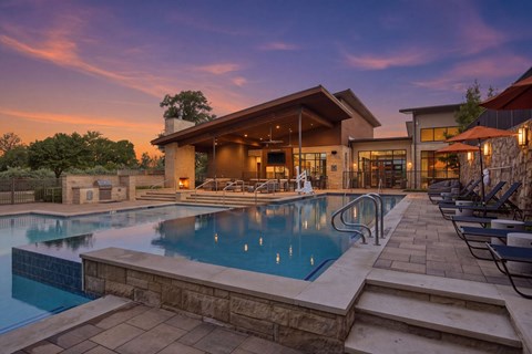 A large house with a pool in the backyard.