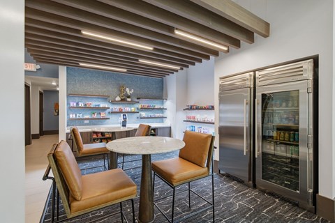 A modern dining area with a table and chairs.