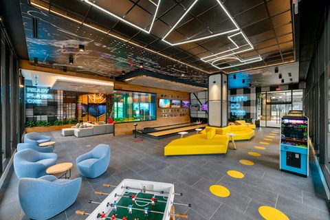 a lounge area with couches and chairs and a pool table