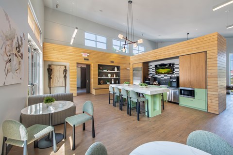 A modern kitchen with a dining table and chairs.