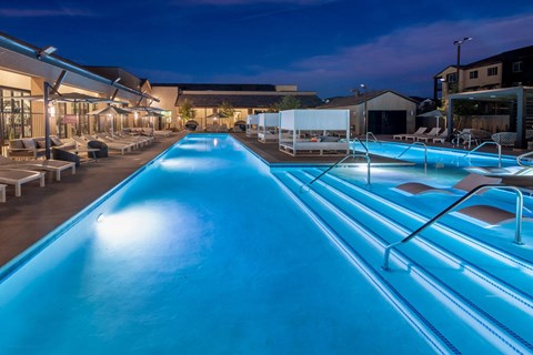 a swimming pool at night at the resort at night