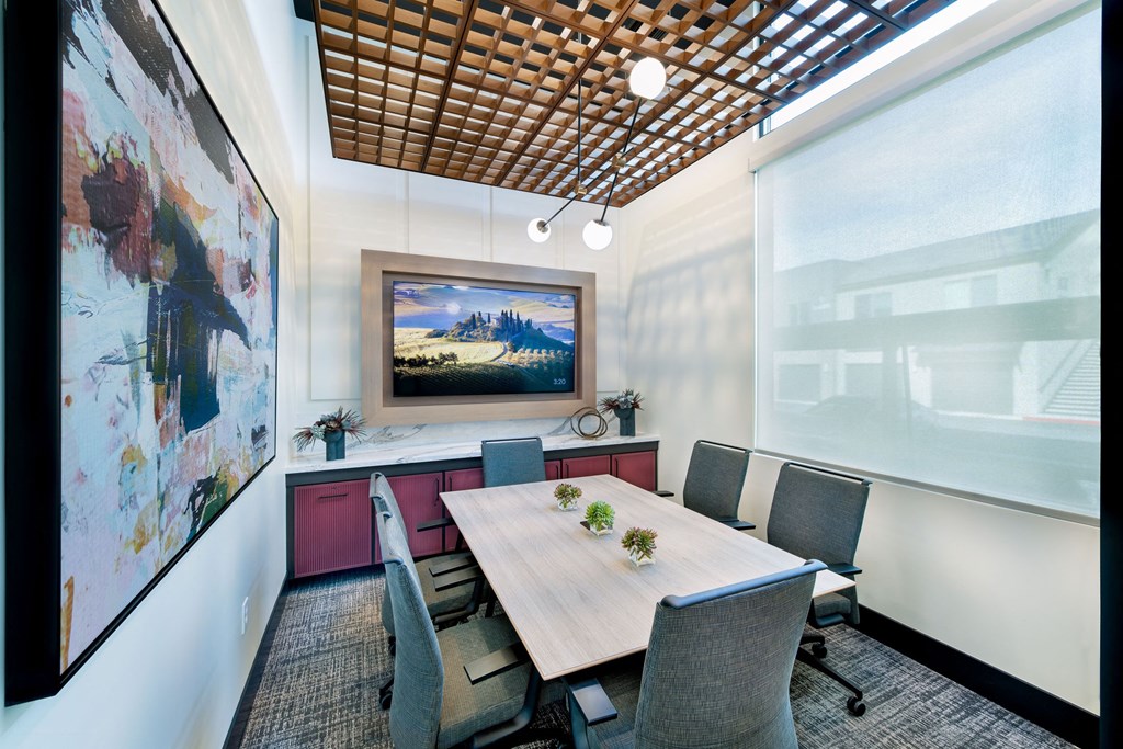 a conference room with a table and chairs