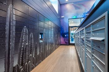 a hallway with lockers and a mural of a space shuttle