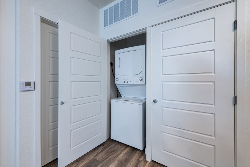 a room with a washer and dryer in a closet