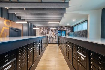 a kitchen with a long counter and a bunch of cabinets