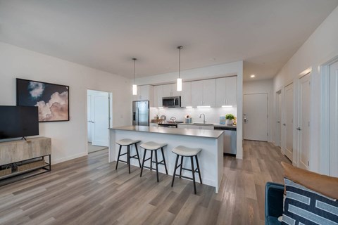 Corsair Apartments Kitchen with Barstool and Island