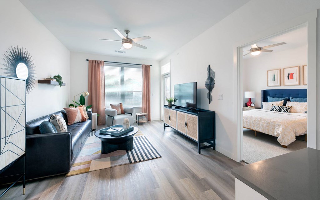 a living room with a couch and a bed