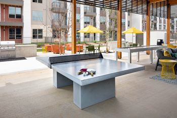 a ping pong table in an outdoor area of a building