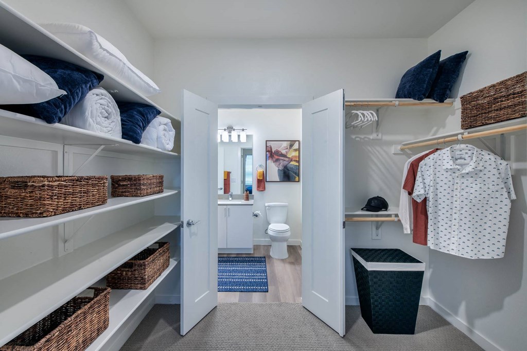 Corsair Apartments Walk-in Closet with View of Bathroom