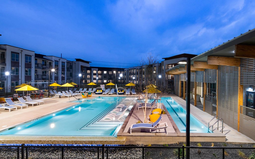 Corsair Apartments Pool with Lounge Chairs