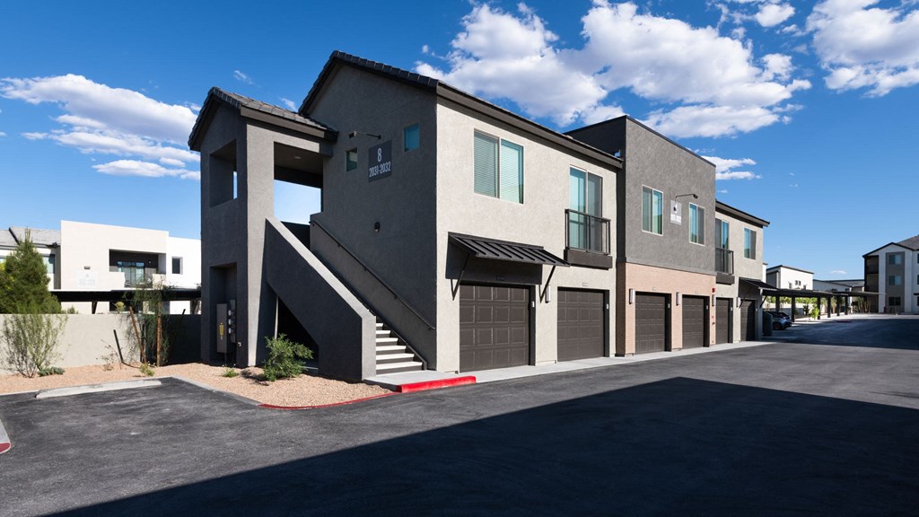 a view of a building with a street in front of it