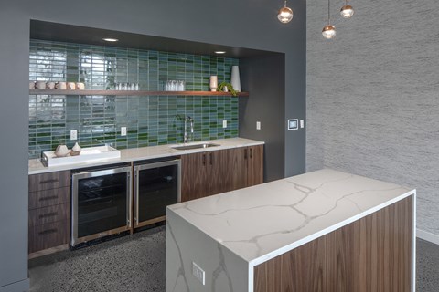 a kitchen with a marble counter top and a sink