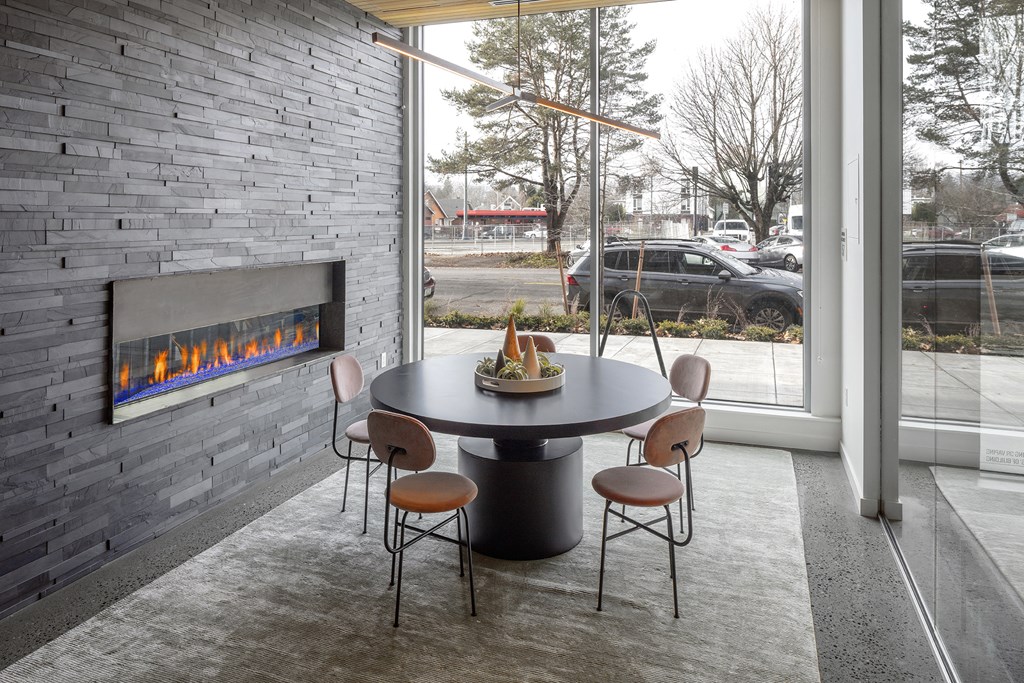 Northpointe Apartments Clubhouse Seating Area by Indoor Fireplace