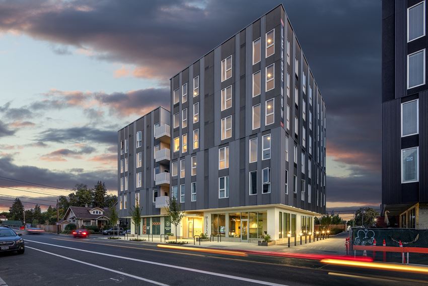 a rendering of an apartment building on a city street