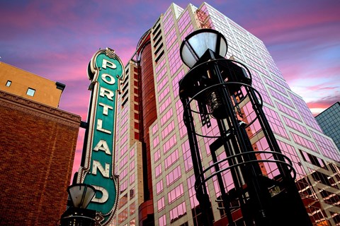 a street light in front of a tall building