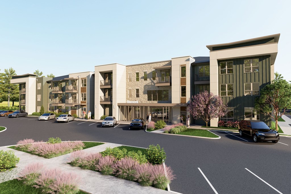 a rendering of an apartment complex on a street with cars